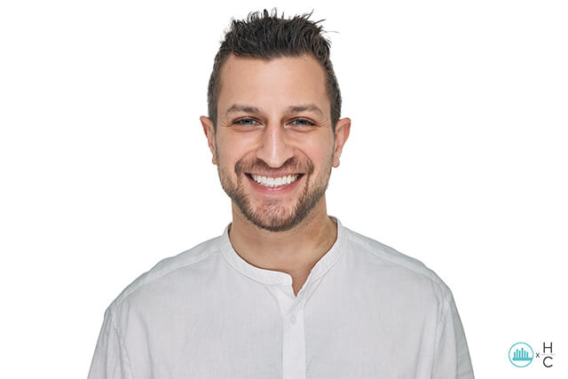 Jeremy treated with Invisalign, a professional in-office whitening and veneers on his two front teeth